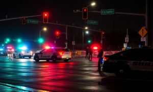 Detroit car crash at 6 Mile and Schaefer with emergency vehicles and police lights